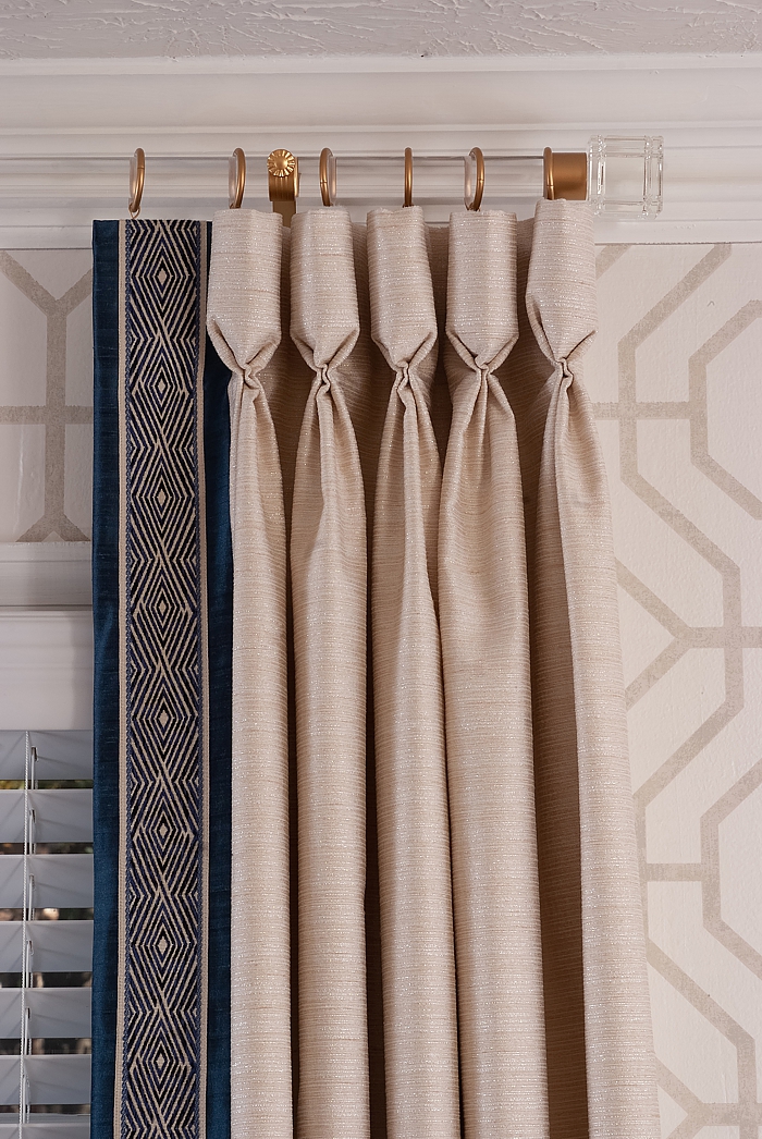 Custom window treatments with a contrasting banding.