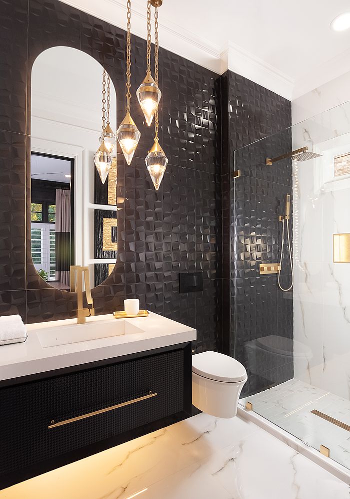 Glam and swanky, black and gold are the feelings the client wanted for their main-level bathroom.
